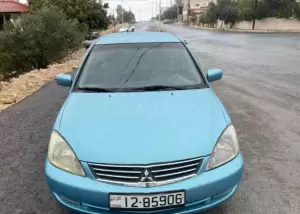 ميتسوبيشي لانسر موديل 2004 للبيع محدثه 2011.